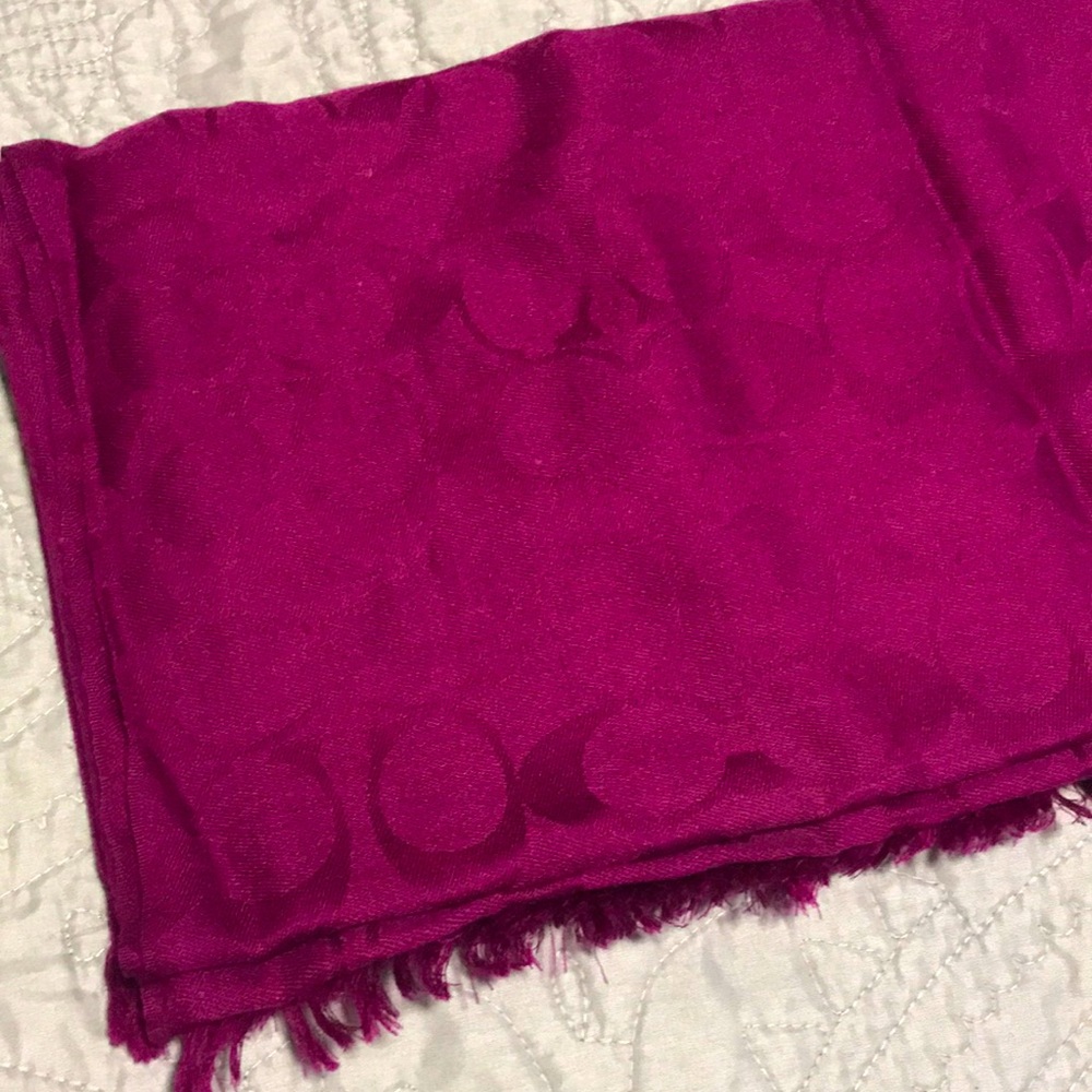 This is a coach scarf without a tag on it and there is a slight pull on it.